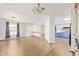 Spacious living area with hardwood floors, seamless flow into kitchen, and ample lighting at 2529 N Barber Dr, Mesa, AZ 85215