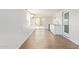 Bright, minimalist living space featuring wood-look flooring and an air conditioner at 2529 N Barber Dr, Mesa, AZ 85215