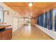 Bright sun room with wood ceiling, tile floors, and many windows for natural light at 2529 N Barber Dr, Mesa, AZ 85215