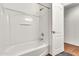 Bathroom featuring a white tub shower with a white surround at 2790 S Alpine Dr, Gilbert, AZ 85295