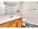 Bathroom featuring a wooden vanity and a shower with white enclosure at 2790 S Alpine Dr, Gilbert, AZ 85295