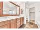 Bathroom features double vanity, warm wood cabinets, and unique tile flooring at 2790 S Alpine Dr, Gilbert, AZ 85295