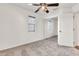 Cozy bedroom featuring neutral carpet, fan, window, and mirrored closet at 2790 S Alpine Dr, Gilbert, AZ 85295