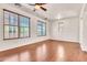 Bright bedroom with multiple windows, wood floors, and neutral paint at 2790 S Alpine Dr, Gilbert, AZ 85295