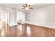 Bedroom features wood-look floors, ceiling fan, and ensuite bathroom at 2790 S Alpine Dr, Gilbert, AZ 85295