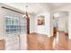 Dining area with wood floors, large sliding glass doors, and modern chandelier at 2790 S Alpine Dr, Gilbert, AZ 85295