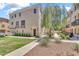 Beautiful townhome with manicured landscaping, a wrought iron balcony, and neutral exterior at 2790 S Alpine Dr, Gilbert, AZ 85295