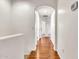 Hallway with hardwood flooring and an arched doorway at 2790 S Alpine Dr, Gilbert, AZ 85295