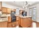 Bright kitchen features wood cabinets, granite counters, black appliances, and a central island at 2790 S Alpine Dr, Gilbert, AZ 85295