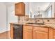 Close-up of a kitchen featuring granite countertops, a tiled backsplash, and stainless steel appliances at 2790 S Alpine Dr, Gilbert, AZ 85295