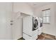 Laundry room featuring a washer and dryer next to a window at 2790 S Alpine Dr, Gilbert, AZ 85295
