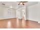 Bright living room features wood-look floors, arched doorways, and neutral paint at 2790 S Alpine Dr, Gilbert, AZ 85295