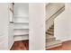 Pantry with white shelves next to a staircase, offering ample storage space at 2790 S Alpine Dr, Gilbert, AZ 85295