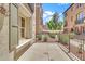 An outdoor patio with wrought iron fencing and a view of lush landscaping at 2790 S Alpine Dr, Gilbert, AZ 85295
