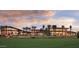 Gorgeous clubhouse with expansive green spaces and abundant palm trees at 28798 N 127Th Ave, Peoria, AZ 85383