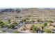 Gorgeous aerial view of a neighborhood nestled against a majestic mountain, showcasing beautiful residences and desert landscape at 3441 E Melody Dr, Phoenix, AZ 85042