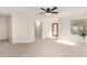 Bright bedroom features neutral carpet, light walls, and a window, creating a versatile and comfortable space at 3441 E Melody Dr, Phoenix, AZ 85042