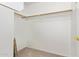 Walk-in closet with carpeted floor and wooden rods for hanging storage at 3441 E Melody Dr, Phoenix, AZ 85042