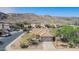 Charming one-story home with a two-car garage and desert landscaping against a mountain backdrop at 3441 E Melody Dr, Phoenix, AZ 85042