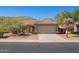 Inviting single-story home with desert landscaping, a two-car garage, and a charming entryway at 3441 E Melody Dr, Phoenix, AZ 85042