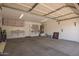 Spacious garage with ample storage cabinets and shelving at 3441 E Melody Dr, Phoenix, AZ 85042