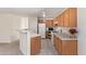 Kitchen with ample cabinets and adjacent to a breakfast bar and other rooms at 3441 E Melody Dr, Phoenix, AZ 85042