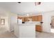 Open kitchen features a breakfast bar and ample cabinet space at 3441 E Melody Dr, Phoenix, AZ 85042