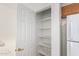 Walk-in pantry with shelving for organized storage solutions at 3441 E Melody Dr, Phoenix, AZ 85042