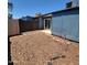 Enclosed backyard features a patio, mulch, and partial block fence at 3645 N 69Th Ave # 99, Phoenix, AZ 85033
