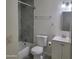 Cozy bathroom featuring a toilet, vanity with sink, and a tiled shower at 3645 N 69Th Ave # 99, Phoenix, AZ 85033
