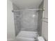 Clean bathroom with tiled shower and built-in niche at 3645 N 69Th Ave # 99, Phoenix, AZ 85033