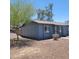 View of the front corner of the home with mature shade tree at 3645 N 69Th Ave # 99, Phoenix, AZ 85033