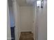 Hallway view leading to rooms with neutral color palette and tile flooring at 3645 N 69Th Ave # 99, Phoenix, AZ 85033