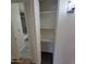 Hallway view featuring closet and glimpse of the bathroom at 3645 N 69Th Ave # 99, Phoenix, AZ 85033