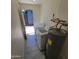 Bright laundry area with modern appliances including washer, dryer, and water heater at 3645 N 69Th Ave # 99, Phoenix, AZ 85033