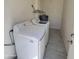 Laundry room with washer, dryer, and water heater at 3645 N 69Th Ave # 99, Phoenix, AZ 85033