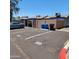 Assigned parking spaces with privacy walls and garbage/recycle bins at 3645 N 69Th Ave # 99, Phoenix, AZ 85033
