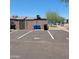 Assigned parking spaces with privacy walls and garbage/recycle bins at 3645 N 69Th Ave # 99, Phoenix, AZ 85033