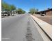 A street view of the neighborhood with mature trees at 3645 N 69Th Ave # 99, Phoenix, AZ 85033