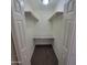 This walk-in closet features custom shelving and a granite countertop at 3645 N 69Th Ave # 99, Phoenix, AZ 85033