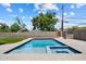 Inviting backyard pool with lush green surroundings, perfect for hot summer days at 4202 E Catalina Dr, Phoenix, AZ 85018