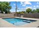 Beautiful backyard pool with blue water and a spa, perfect for enjoying sunny days at 4202 E Catalina Dr, Phoenix, AZ 85018