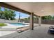 Inviting backyard with a sparkling pool, covered patio, and plenty of space for relaxing at 4202 E Catalina Dr, Phoenix, AZ 85018