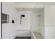Contemporary bathroom with standalone shower featuring elegant tile work and a built-in bench at 4202 E Catalina Dr, Phoenix, AZ 85018