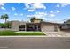 Striking modern home with an attached garage, lush grass, and well-maintained landscaping at 4202 E Catalina Dr, Phoenix, AZ 85018