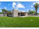 Beautifully landscaped yard with lush, green grass offering great curb appeal to this modern home at 4202 E Catalina Dr, Phoenix, AZ 85018