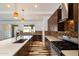 Bright modern kitchen featuring stainless steel appliances, stylish backsplash, and hardwood floors at 4202 E Catalina Dr, Phoenix, AZ 85018