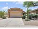 Attractive single-story home with a two-car garage and well-maintained desert landscaping at 4327 E Desert Sky Ct, Cave Creek, AZ 85331