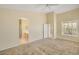 Spacious main bedroom with neutral walls, carpet, large windows, and access to bathroom and walk-in closet at 4327 E Desert Sky Ct, Cave Creek, AZ 85331