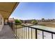 Expansive balcony view of the community pool, tennis courts, and well-maintained landscaping at 461 W Holmes Ave # 323, Mesa, AZ 85210